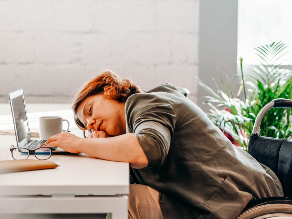 Women asleep at desk: 4 reasons why caffeine doesn't affect me