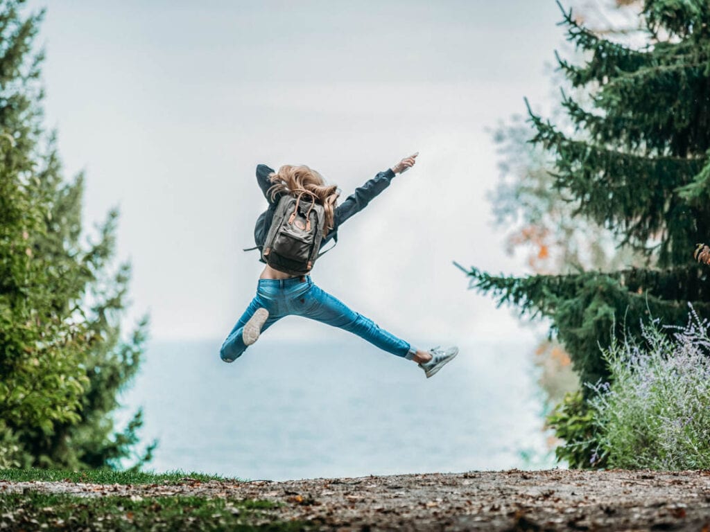 Person jumping for joy from the alternative ways to energize yourself if caffeine doesn't affect you
