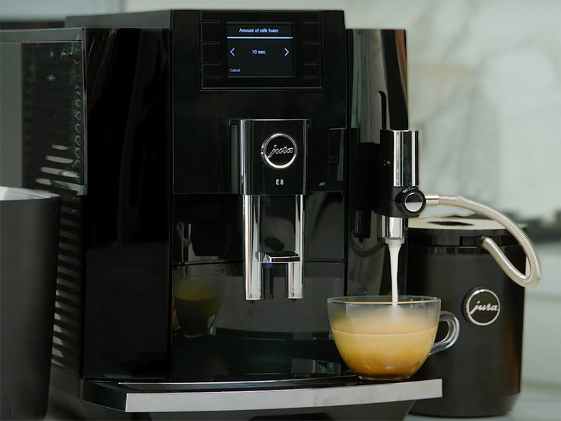 Jura E8 making a milky coffee drink