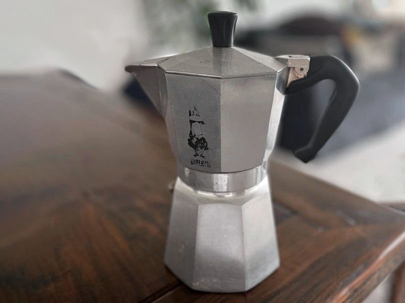 Bialetti Moka Express sitting on a wooden table