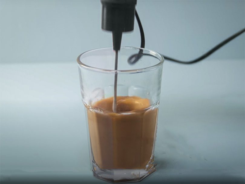 Using electric whisk to make frappe