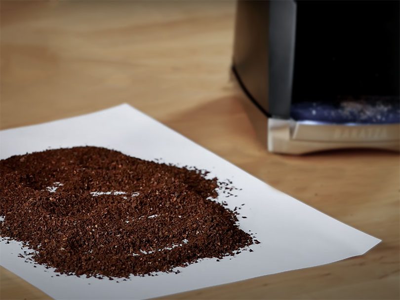 Sheet of paper with medium-fine coffee grinds from the Baratza Virtuoso Plus