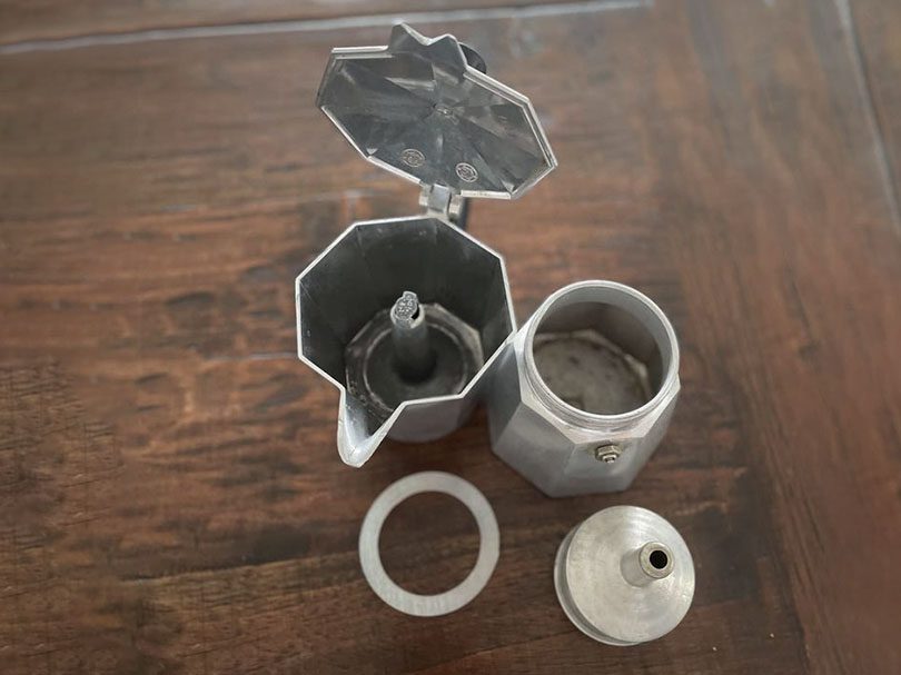 Parts of the Bialetti Moka Express separated on a table