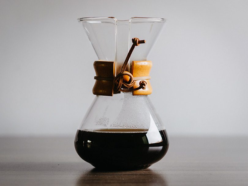Chemex coffee maker filled with freshly brewed coffee