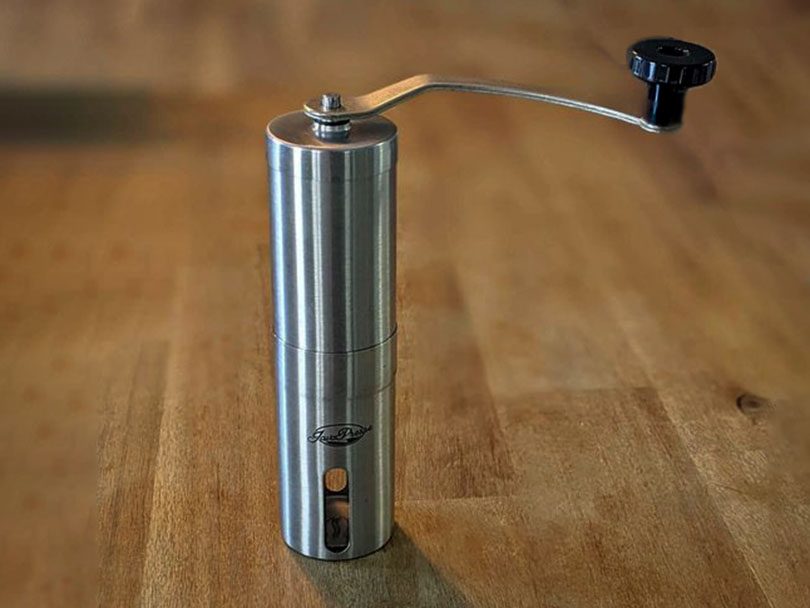 Javapresse manual coffee grinder on table