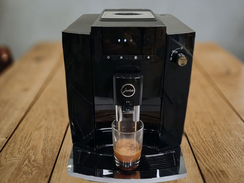 Jura E4 coffee maker making a fresh shot of espresso