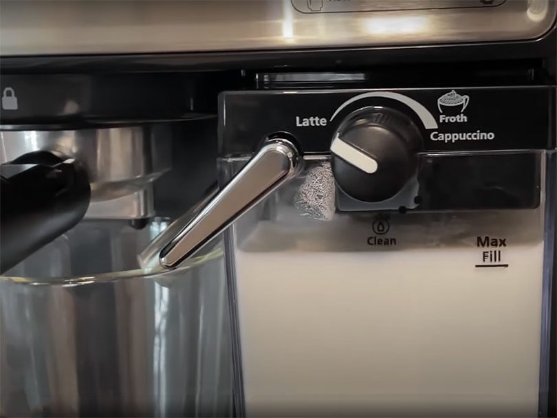 Close up of the Cafe Barista's milk frother