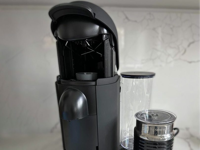 Nespresso Vertuo Plus with the lid open to place a coffee capsule inside