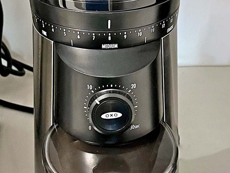 Close up of the grind adjustment and timer dials on the Oxo Brew burr grinder