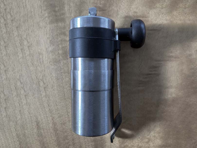 Porlex Mini hand grinder with handle secured into the side
