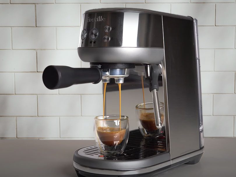 A shot of espresso being made by the Breville Bambino espresso machine