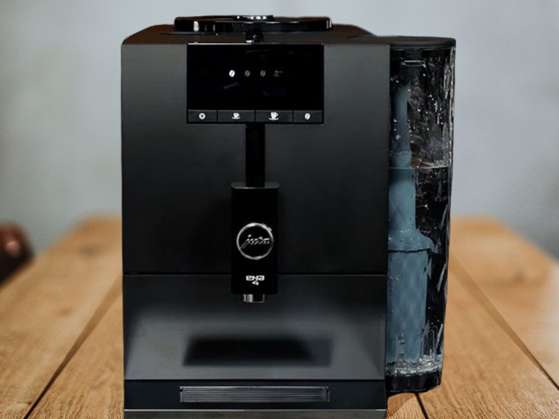 Straight on view of the Jura ENA 4 on a wooden table