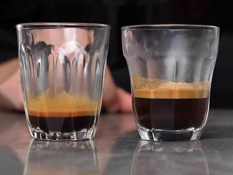 Short ristretto in a glass beside an espresso to show the size difference