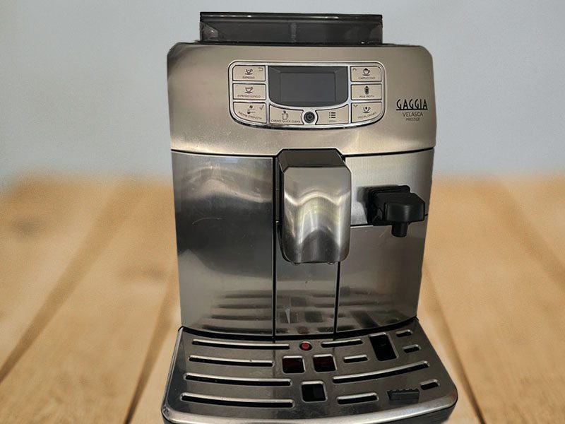 Front view of the Gaggia Velsaca Prestige on a wooden table
