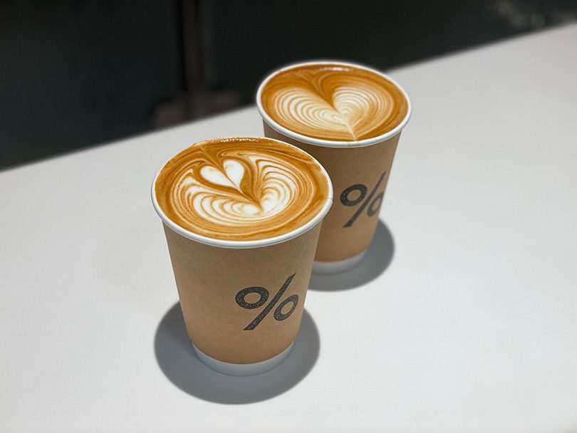 Two Kyoto lattes from % Arabica sitting side by side