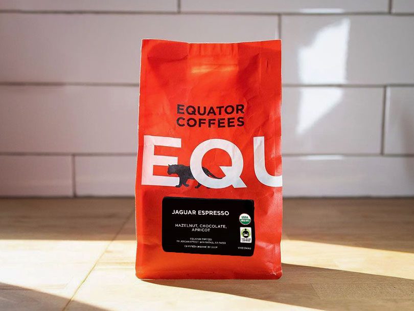 Bag of Jaguar Espresso beans by Equator Coffees, sitting on kitchen countertop