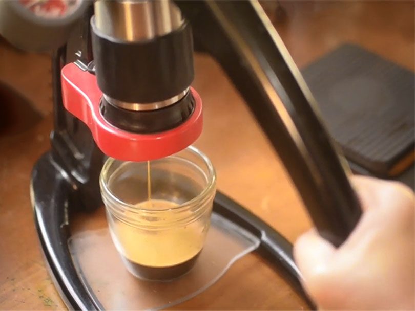Pulling a shot of espresso using the manual lever of the Flair Classic espresso maker