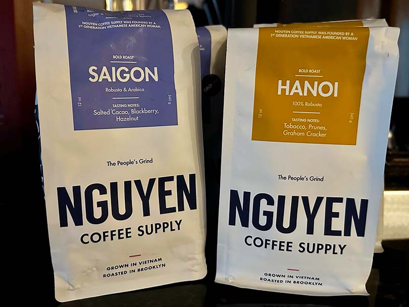 Two bags of Nguyen Coffee Supply - the Saigon and Hanoi blends sitting side-by-side