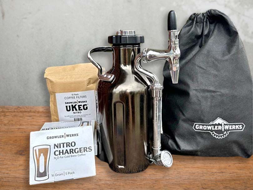 Growler Werks uKeg with storage bag, spare nitro chargers, and coffee filters