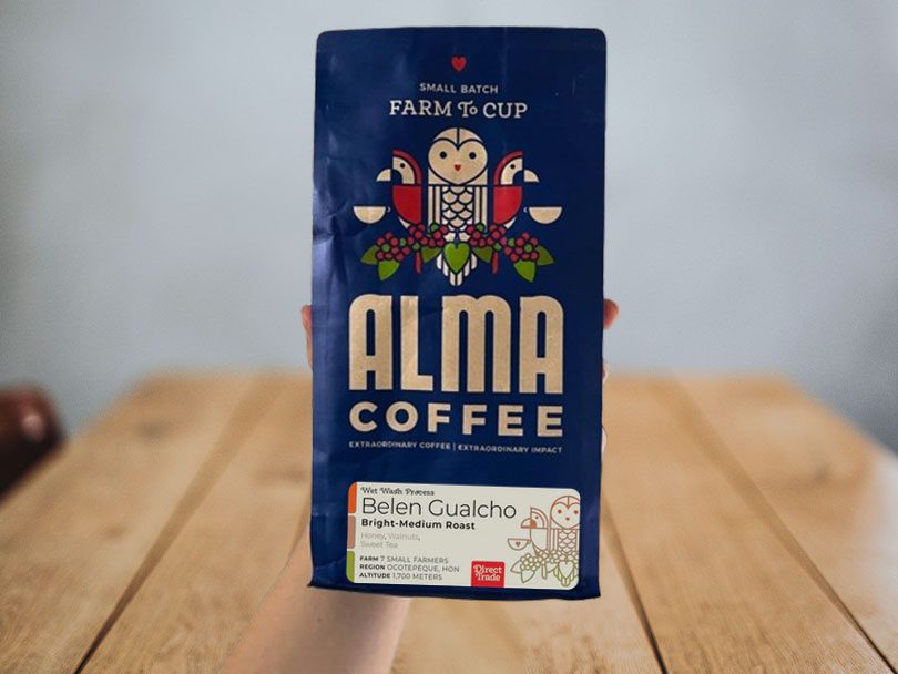 Holding a bag of Alma Coffee, Belen Gualcho