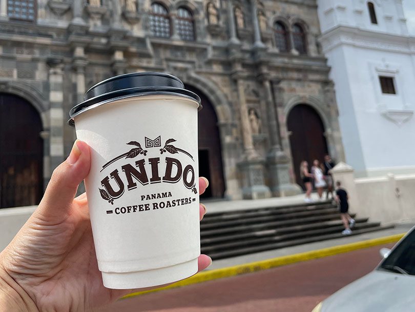 A takeaway cup of Panama geisha coffee from Unido in Panama City center