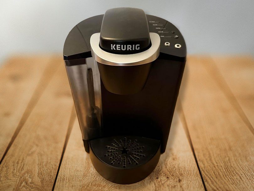 Keurig K-Classic turned off and sitting on a wooden table