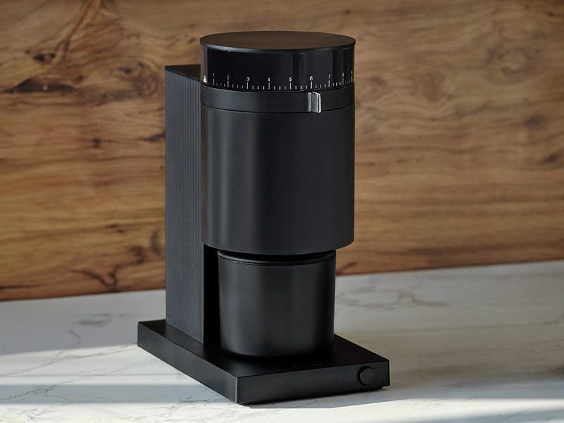 Fellow Opus electric conical burr grinder on marble table