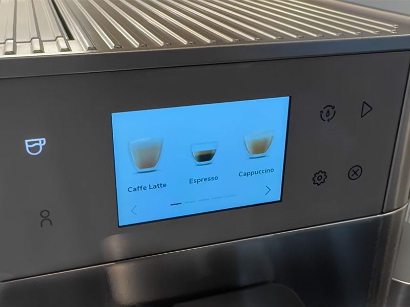 Drinks selection screen on the KitchenAid KF7 showing Caffe Latte, Espresso, and Cappuccino options