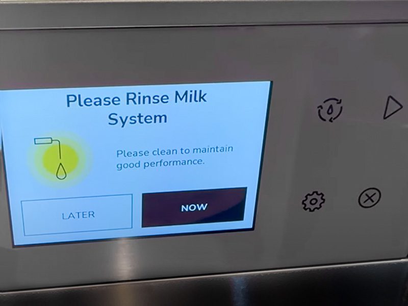 KitchenAid KF7 display screen saying 'Please rinse milk system'