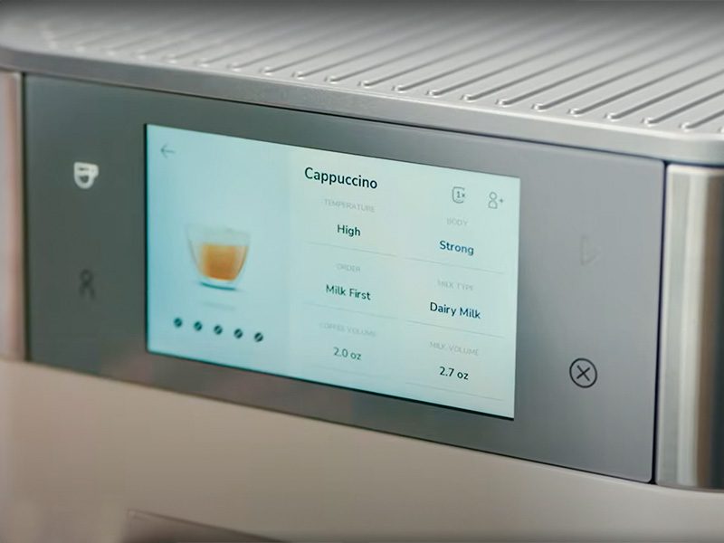 Full user interface of the KitchenAid KF8 showing the buttons and touchscreen. Screen is displaying cappuccino settings