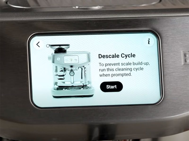 The touchscreen for the Breville Oracle Jet showing a prompt to start the Descale Cycle to deep clean the espresso machine
